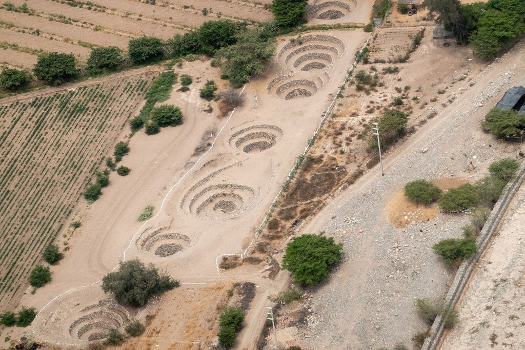 Aerial view of multiple puquios chimneys, part of a pre-Columbian irrigation system.