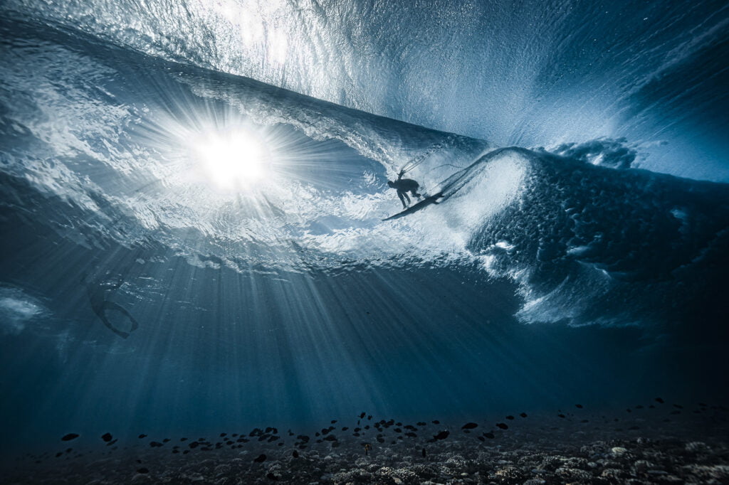 © Ben Thouard - A surfer viewed from beneath the wave. © Ben Thouard - A surfer viewed from beneath the wave.