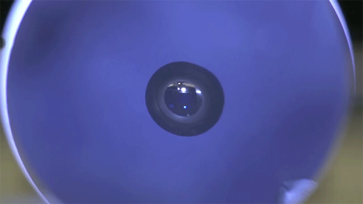 A levitated droplet is spun up to form a dumbbell-like shape. A levitated droplet is spun up to form a dumbbell-like shape.