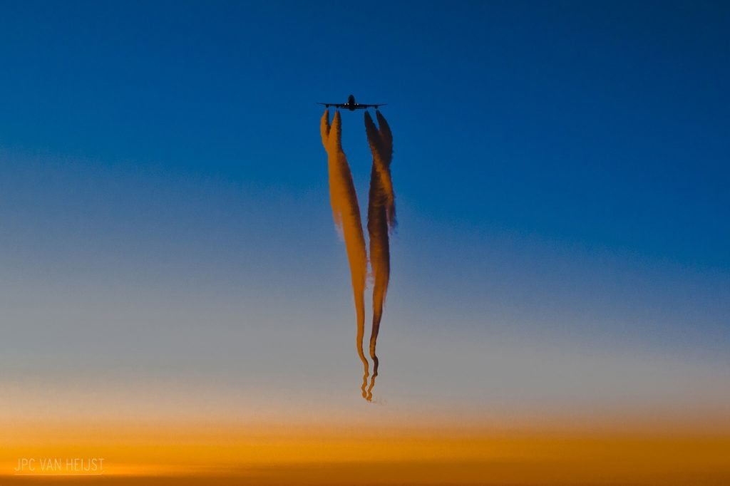 The contrails from a 4-engine aircraft wrap around one another due to vortex interactions. Photo by JPC Van Heijst. The contrails from a 4-engine aircraft wrap around one another due to vortex interactions. Photo by JPC Van Heijst.