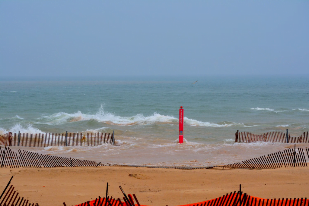 The unusually large waves were driven into the shore by a large atmospheric pressure drop. The unusually large waves were driven into the shore by a large atmospheric pressure drop.