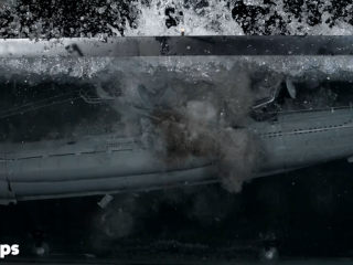 Water erupts on the surface as the submarine model's inner balloon gives.