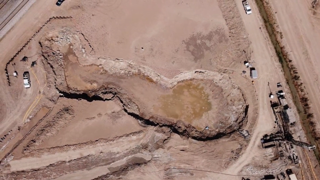 Aerial view of the Niland Geyser, the world's only known moving mud puddle. Aerial view of the Niland Geyser, the world's only known moving mud puddle.