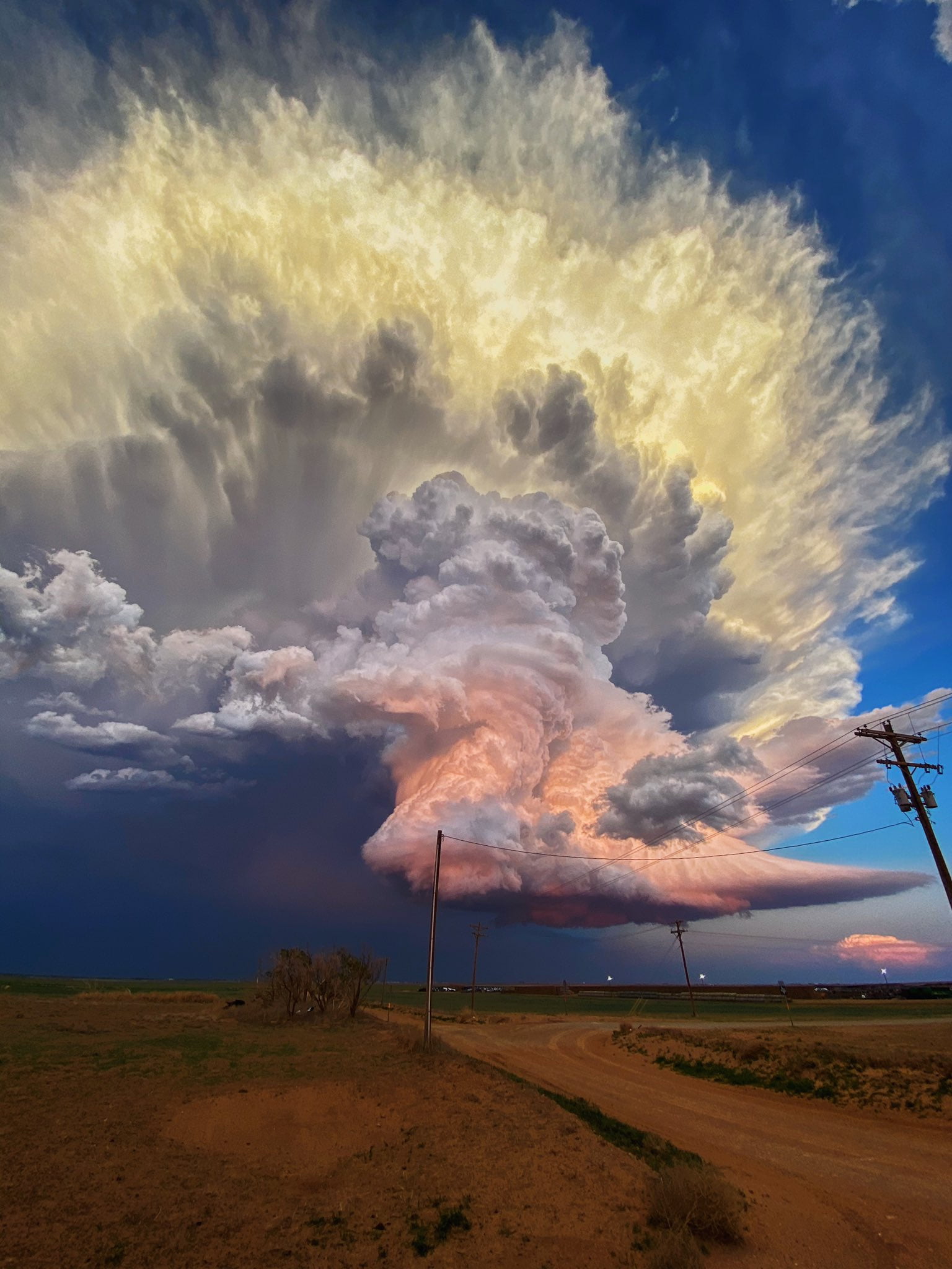 A towering, candy-colored storm cloud over Texas.