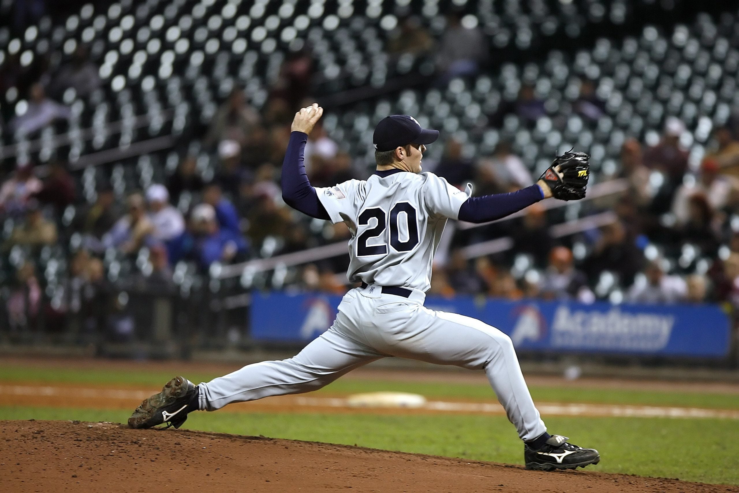A pitcher about to throw a baseball.