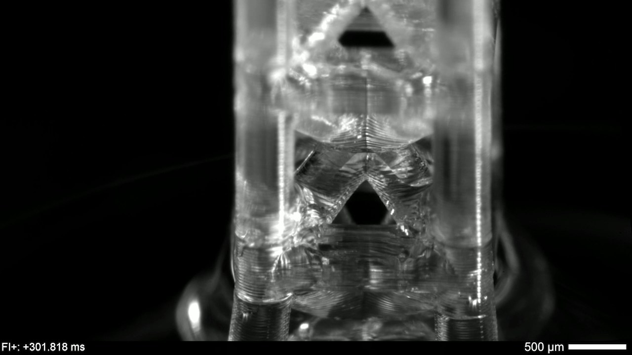 Close-up view of a single, 3D-printed unit cell as capillary action fills it.