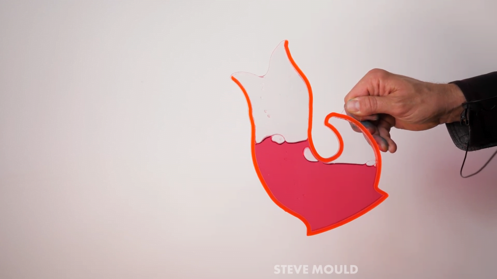 The sound comes from air bubbles moving back and forth between the tail and body sections of the jug.