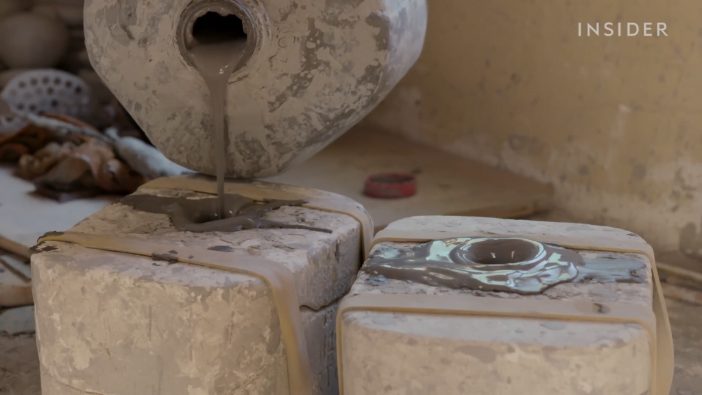 Here the clay mixture -- called slip -- is poured into molds. Here the clay mixture -- called slip -- is poured into molds.