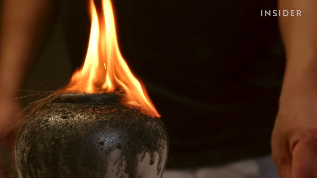 With wood chips burning inside, horsehair placed on the pot carbonizes to leave background designs. With wood chips burning inside, horsehair placed on the pot carbonizes to leave background designs.