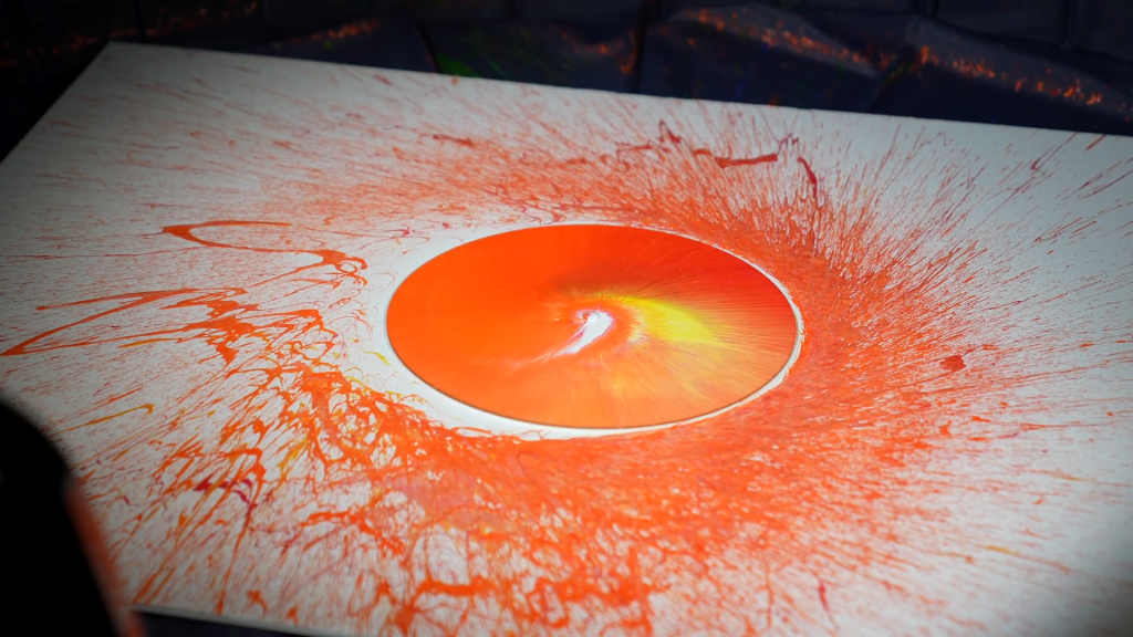 Paint flung from a spinning disk. Paint flung from a spinning disk.