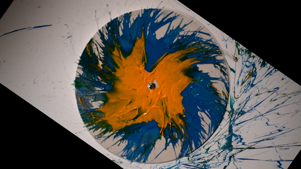 Paint flung from a spinning disk. Paint flung from a spinning disk.