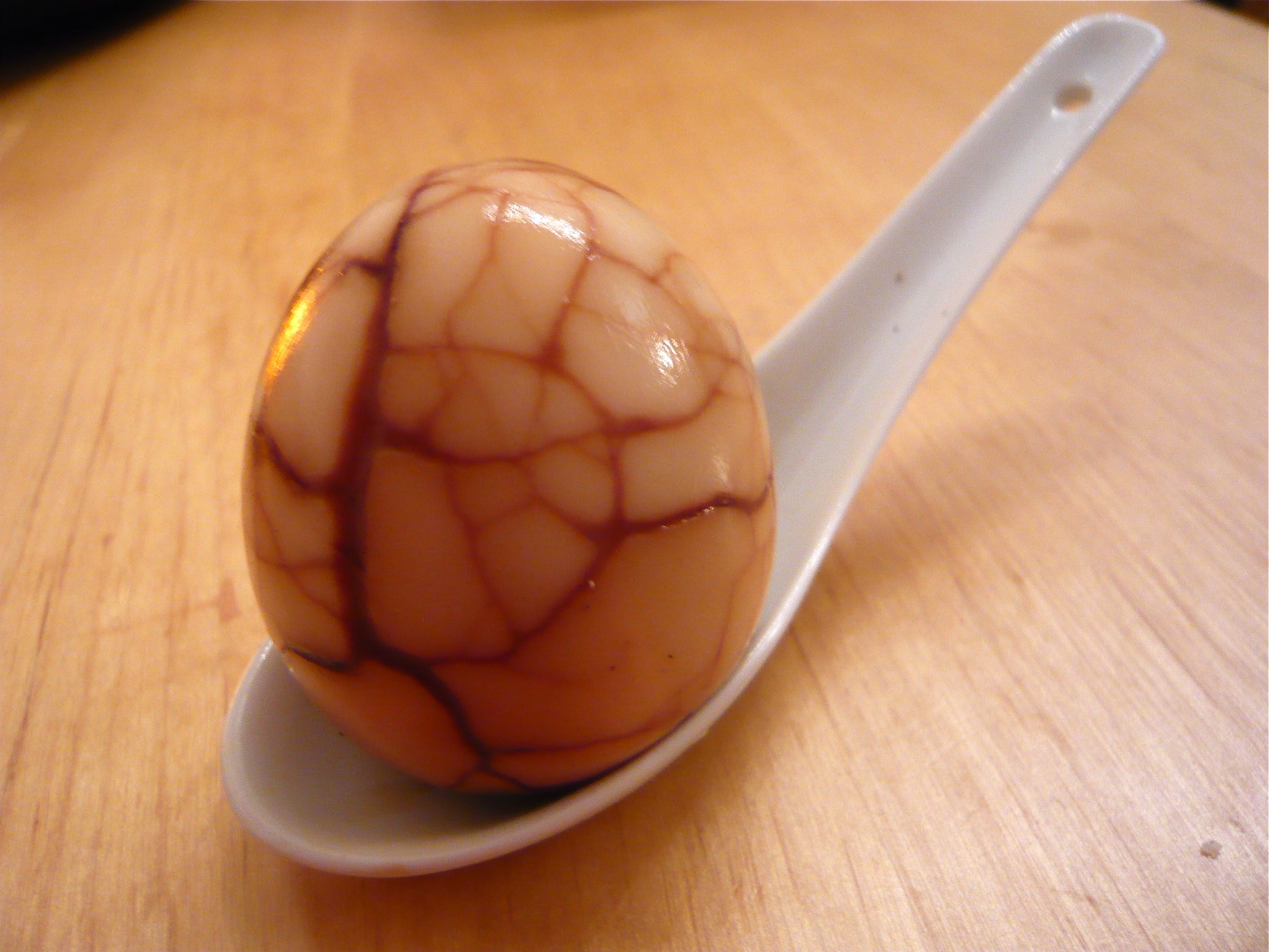 An egg after simmering in a tea and soy solution.