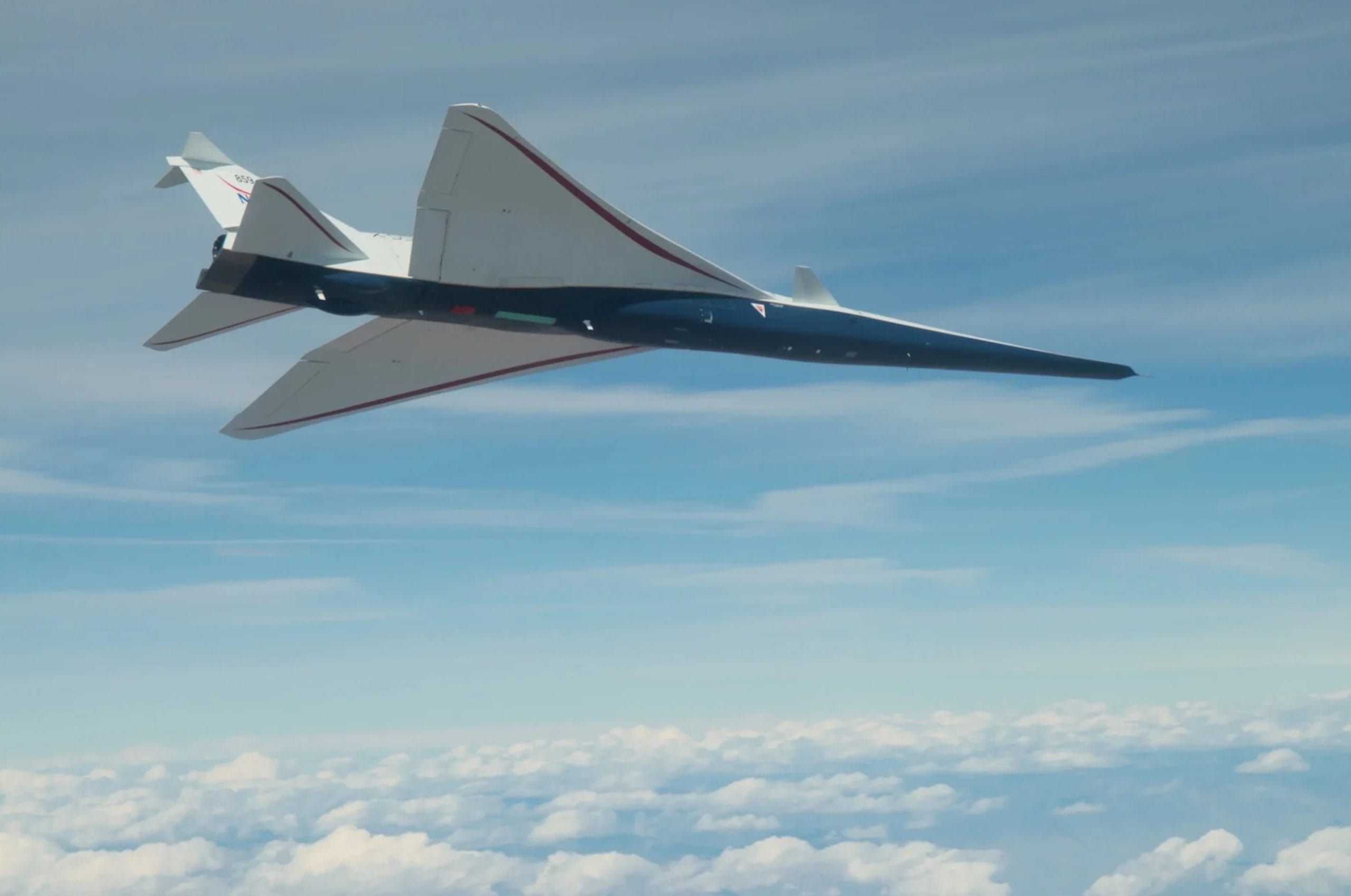 The X-59 experimental aircraft in flight.