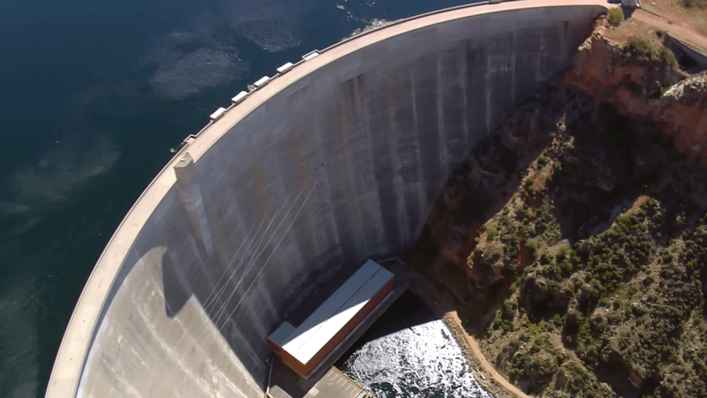 Overhead view of an arch dam. Overhead view of an arch dam.