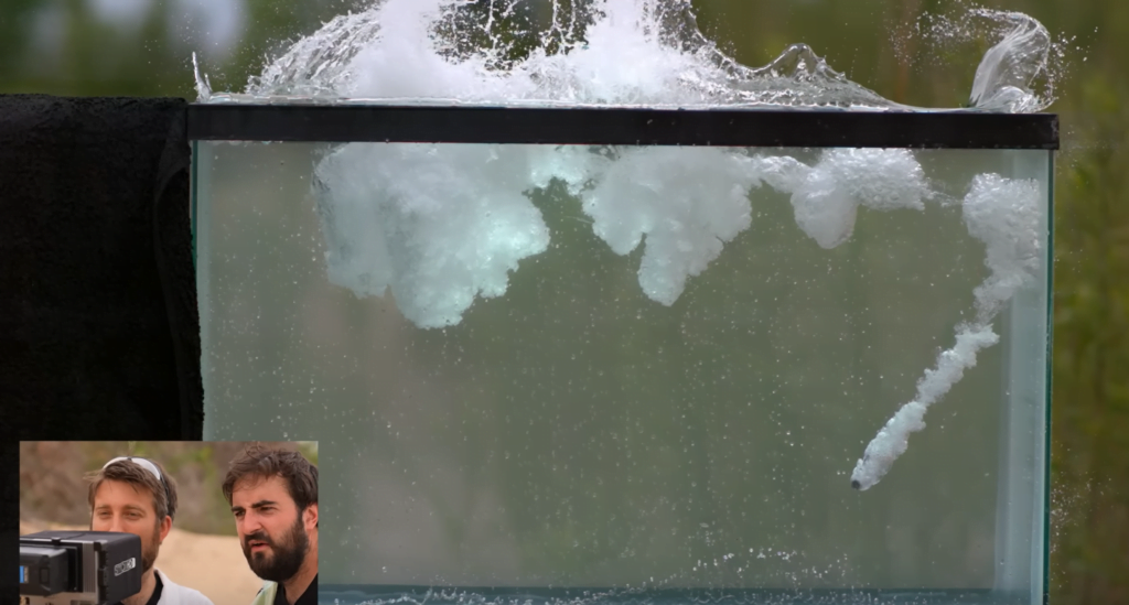 A bullet that didn't bounce leaves behind a trail of cavitation marking its path through the tank. A bullet that didn't bounce leaves behind a trail of cavitation marking its path through the tank.