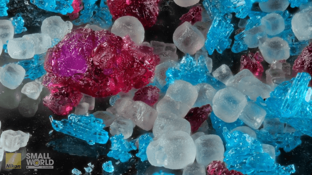 Various colorful crystals of salts jumbled together. Various colorful crystals of salts jumbled together.