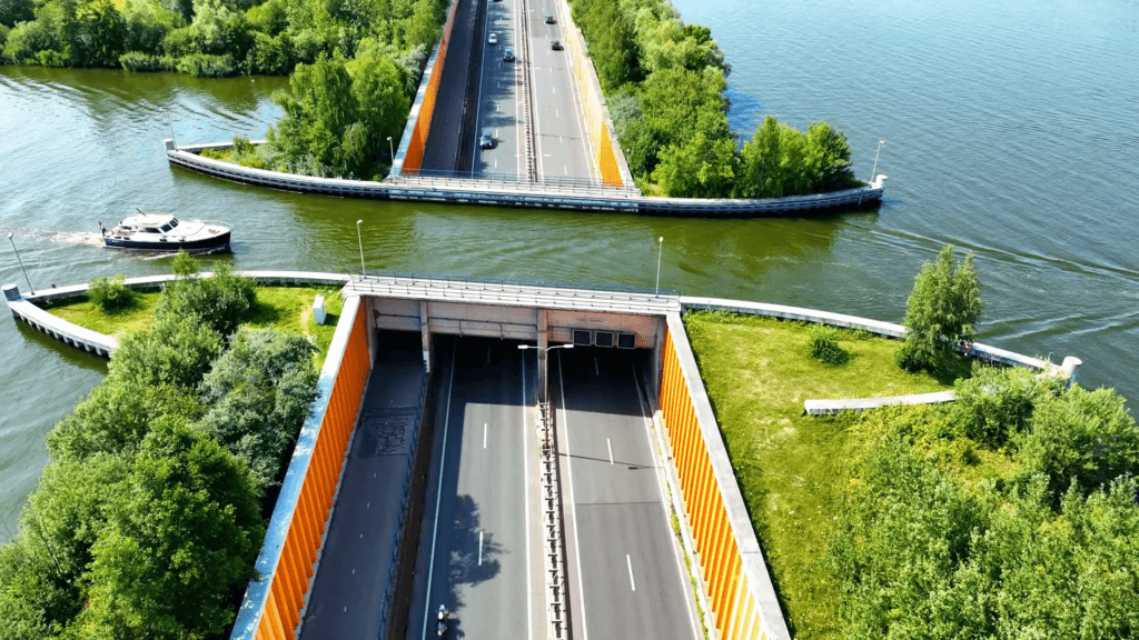 A bridge allowing boat traffic above a roadway. A bridge allowing boat traffic above a roadway.