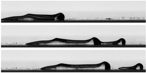 This series of images shows an elongated droplet subjected to airflow moving from left to right. Waves form on the drop and move downstream in a fashion similar to a caterpillar crawling.