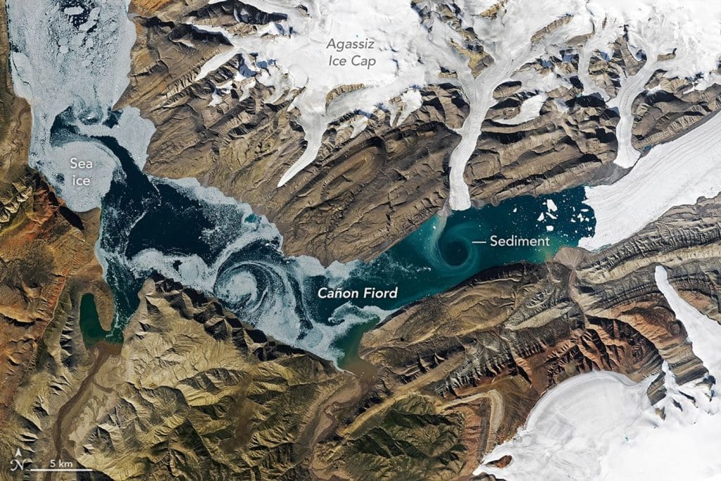 Satellite image of sea ice and sediment swirling in Cañon Fiord.