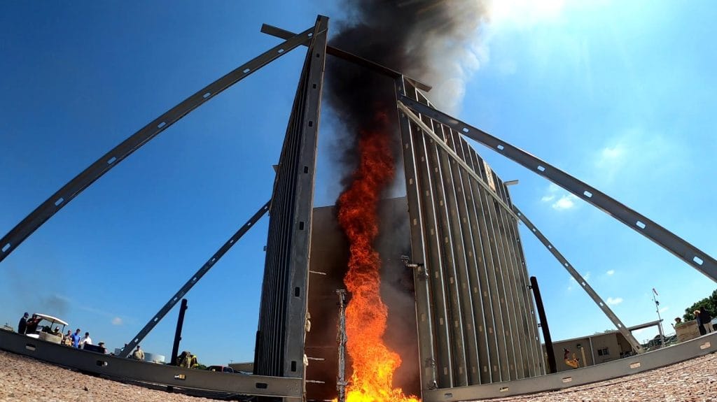 View of a large-scale fire whirl experiment built around an oil spill on a pool.