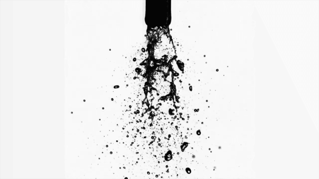 An effervescent jet made up of many droplets and ligaments of fluid.