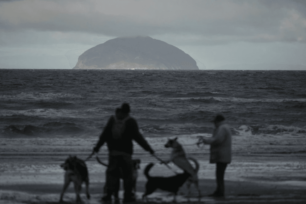 Ailsa Craig, an uninhabited Scottish granite isle, sits in the distance.