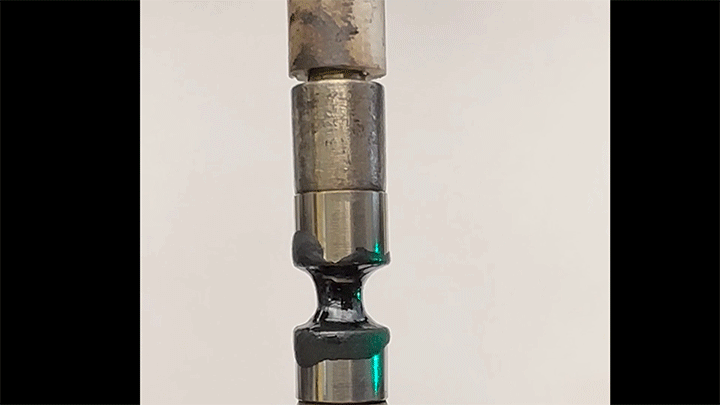 A viscous hydrocarbon fluid gets stretched at 100 mm/s.