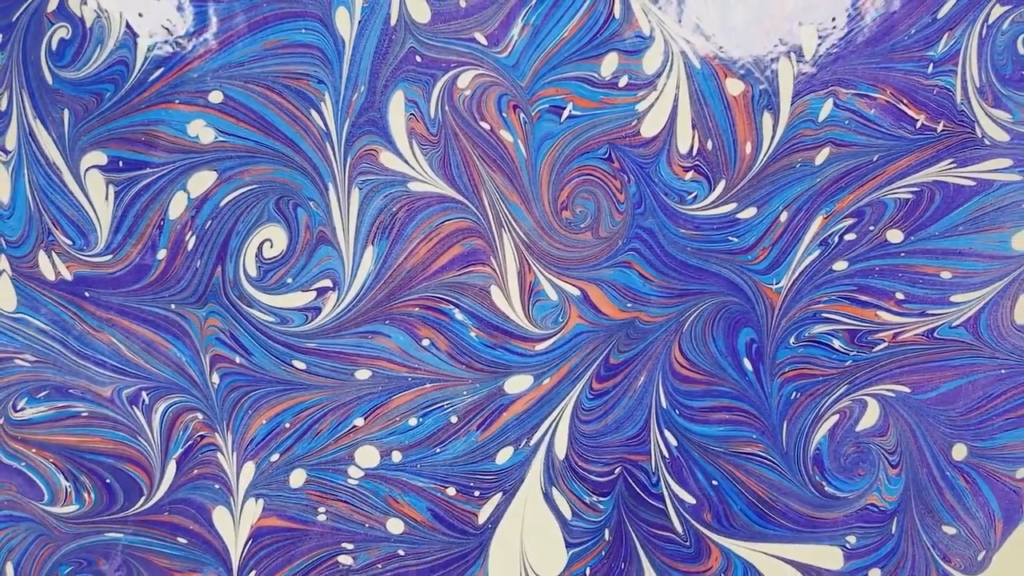 The hydrodynamics of marbling depend first on interfacial physics and then on low-Reynolds number mixing. The hydrodynamics of marbling depend first on interfacial physics and then on low-Reynolds number mixing.