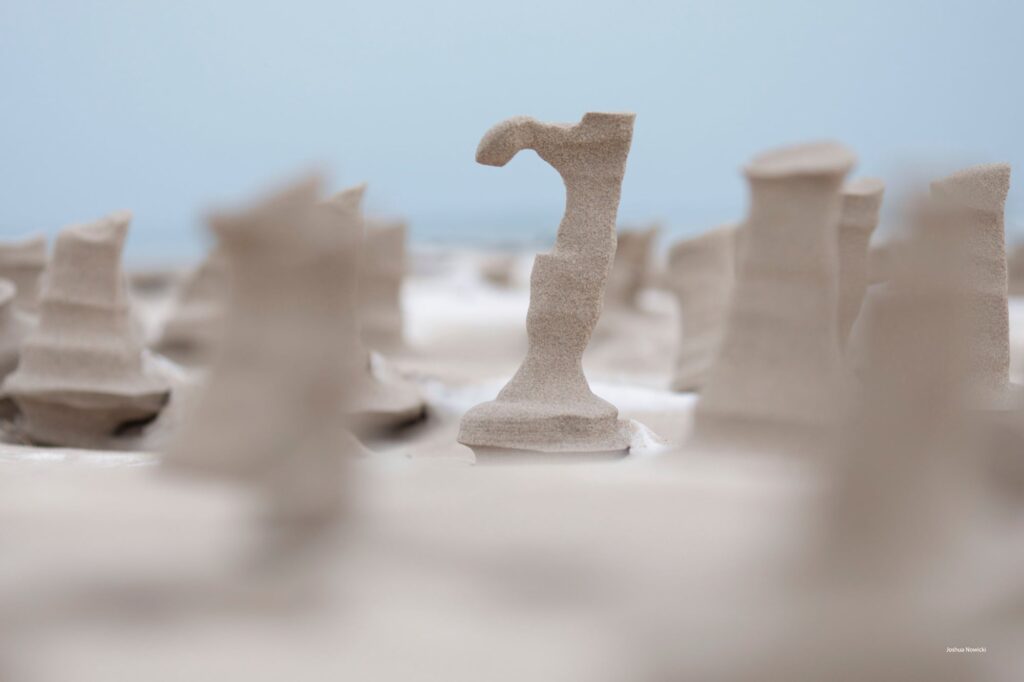 Frozen, wind-sculpted sand on a Lake Michigan beach.