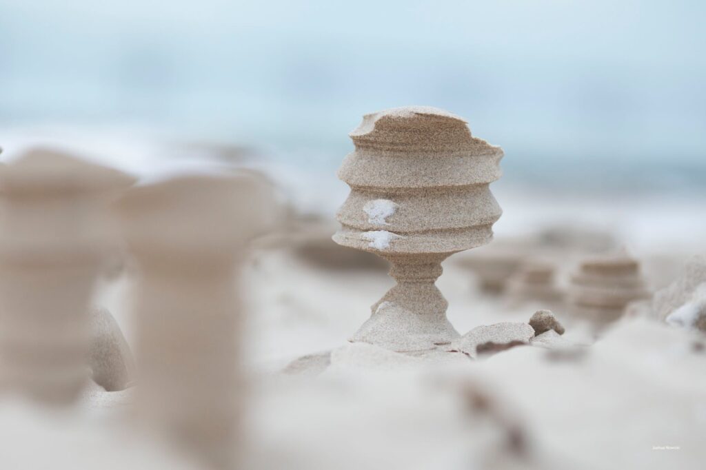 Frozen, wind-sculpted sand on a Lake Michigan beach.