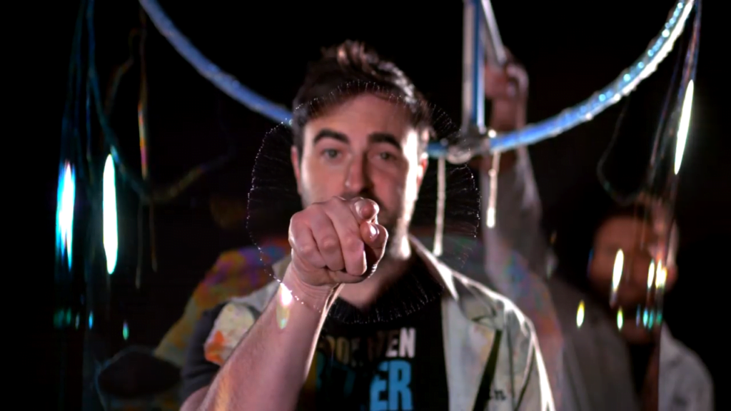 Note how the edges of the expanding hole have thin ligaments of fluid breaking into droplets.