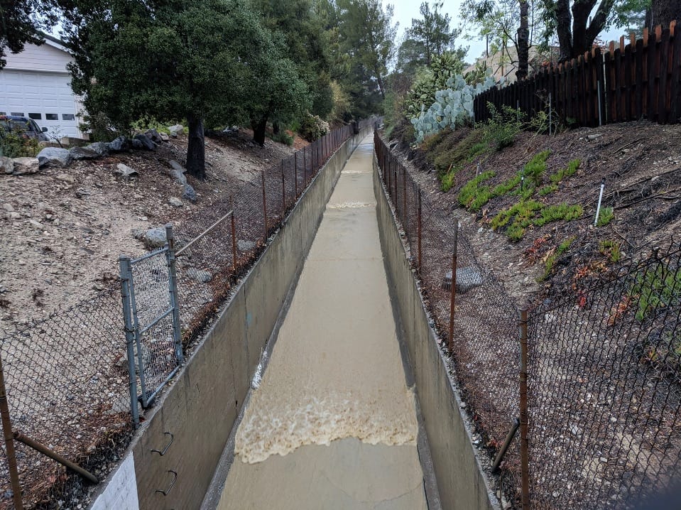 Roll Waves in Debris Flows