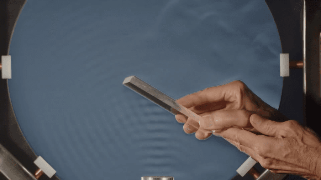 With a strobed light source, a schlieren system can show sound waves reflecting off a surface. With a strobed light source, a schlieren system can show sound waves reflecting off a surface.