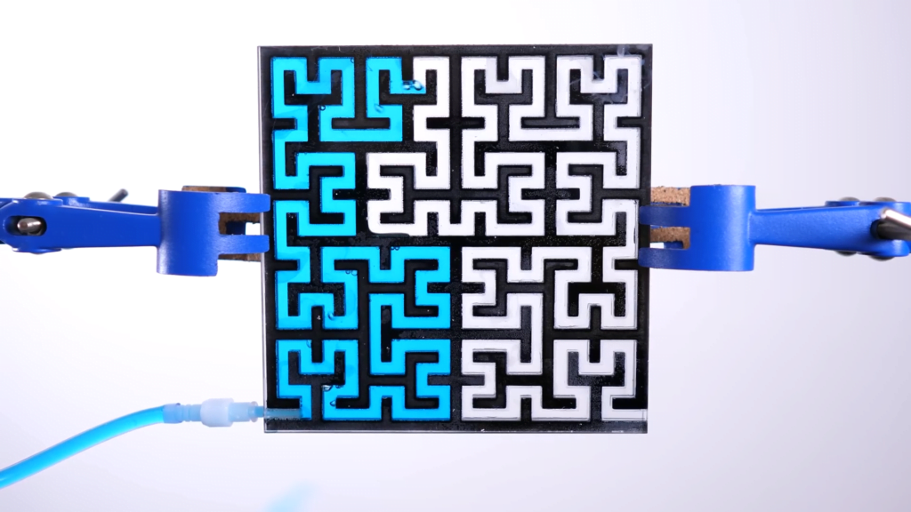 A 2D-version of a Hilbert curve being filled with dyed water. A 2D-version of a Hilbert curve being filled with dyed water.