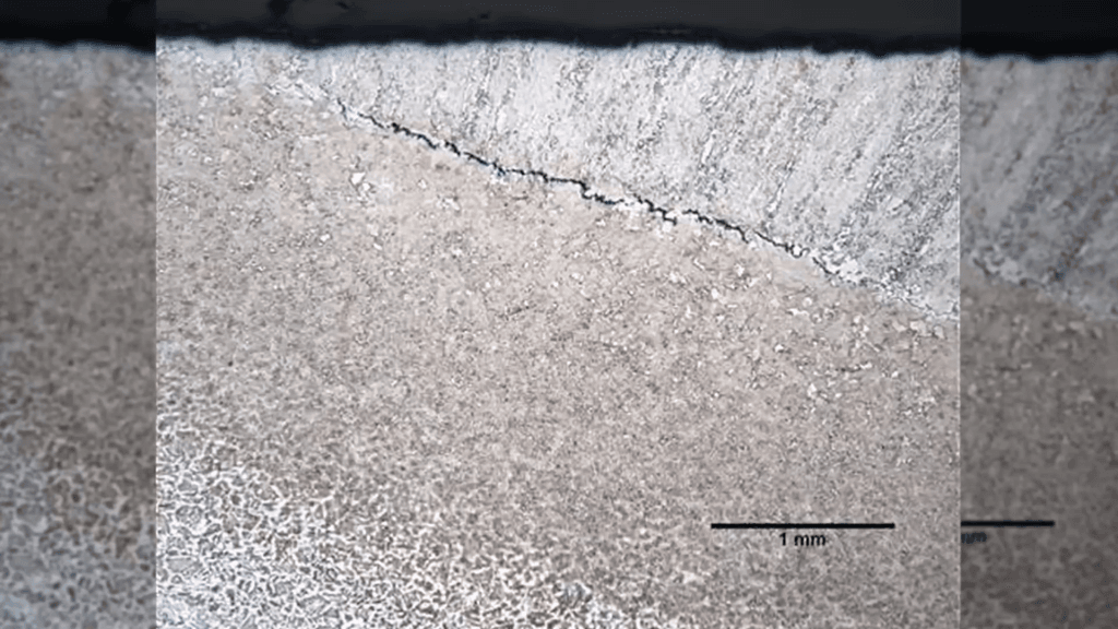 Microscopic image showing a developing fissure inside a steel sample.