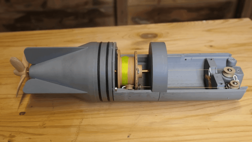 This model shows the interior of a Brennan torpedo, which was launched by pulling a cable out the back of the torpedo.