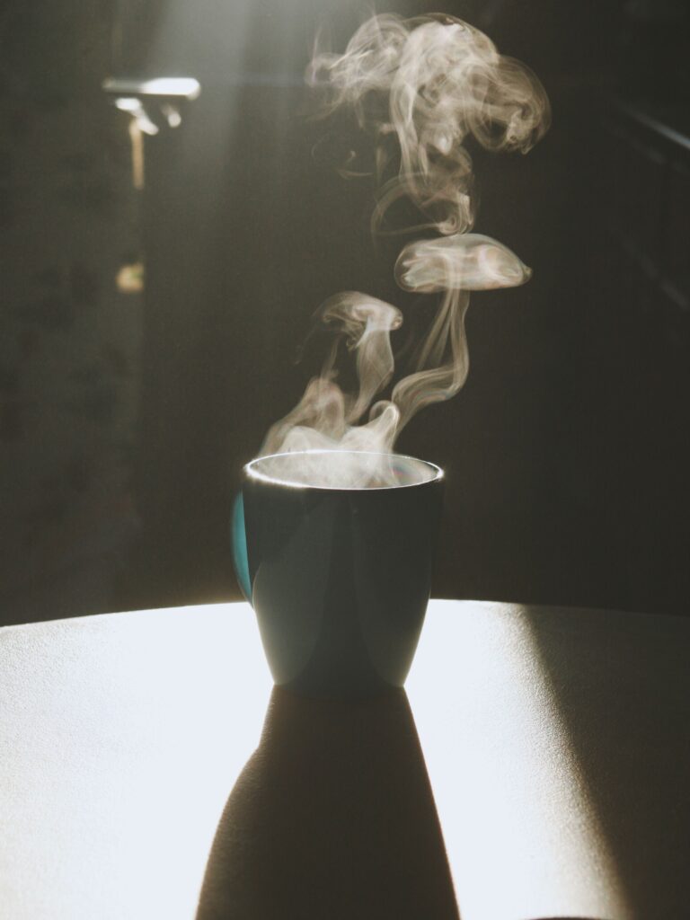 Steam rises from a hot beverage.
